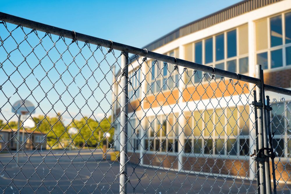 Q&A with School Shooting Expert Tom Czyz Q&A with School Shooting Expert Tom Czyz - School with fence in foreground